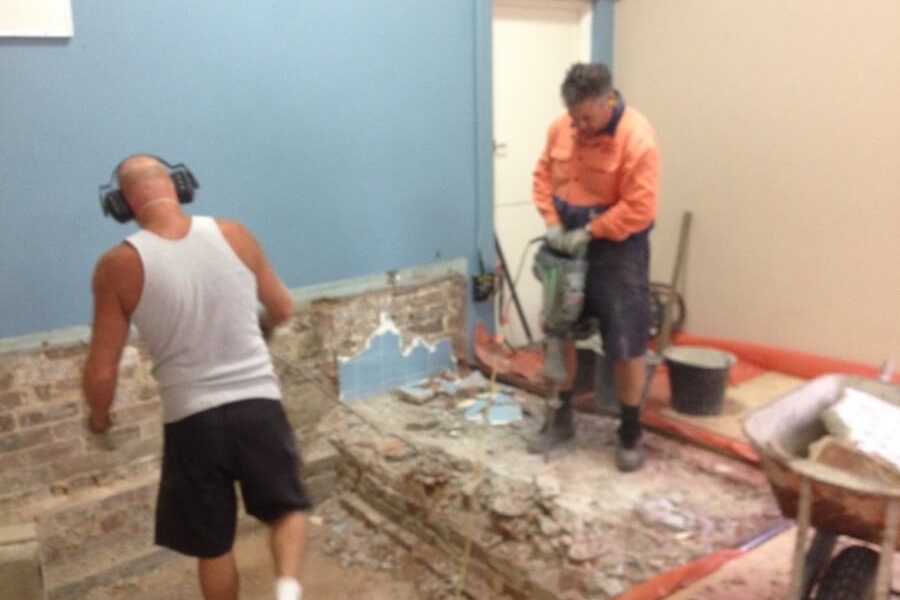 Jack Hammering Concrete from old stage West Ryde Family Church- The Right Builder